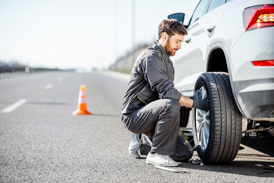 Jeep Roadside Assistance changing a tire