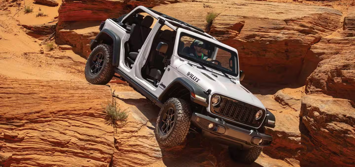 The 2026 Jeep Wrangler crawling down rocky terrain