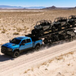 2027 RAM 2500 Power Wagon towing a set of UTVs